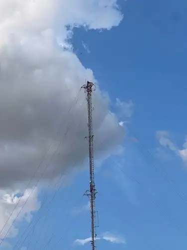 Towering above, touching the clouds.